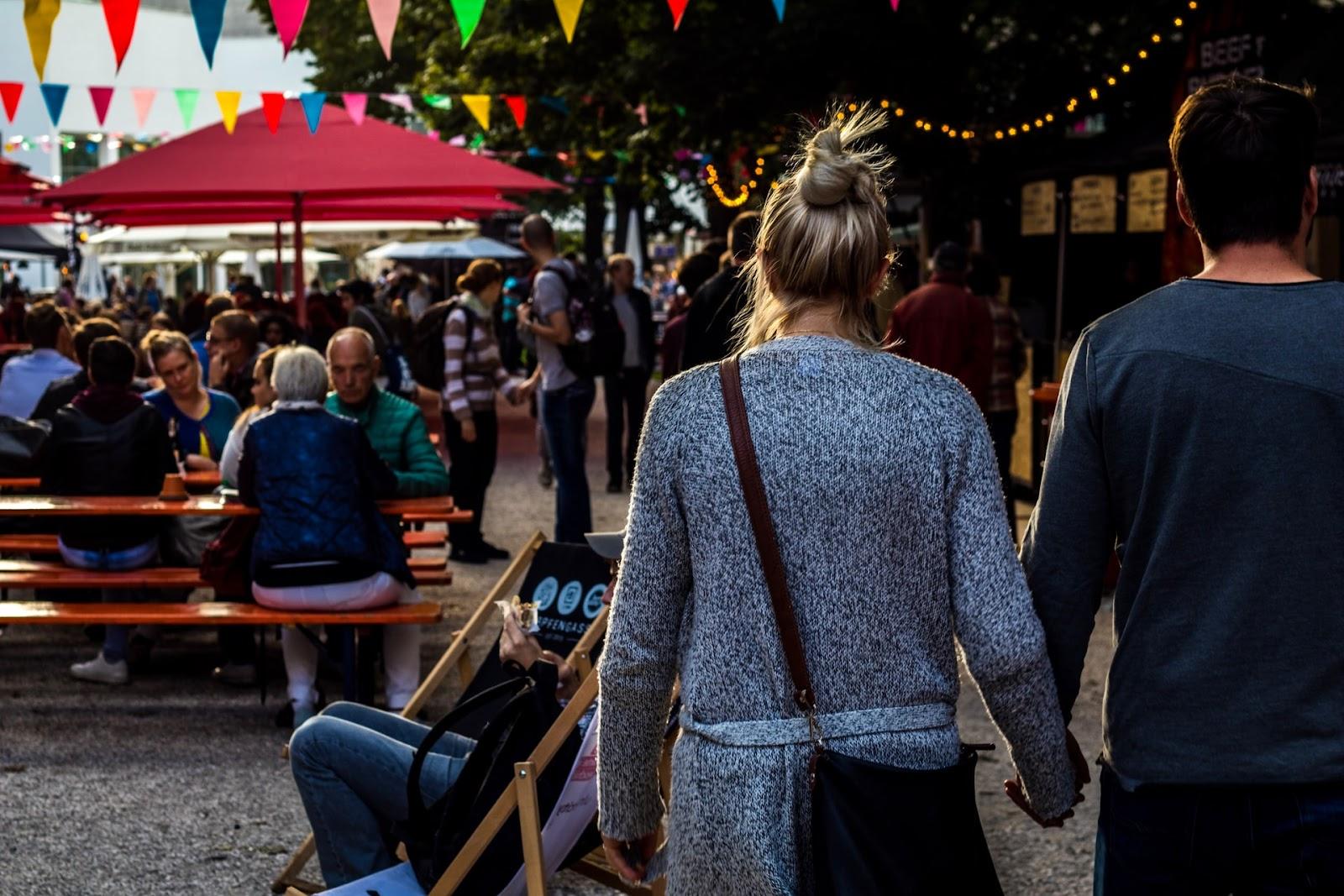 Couple walking together at a community event 